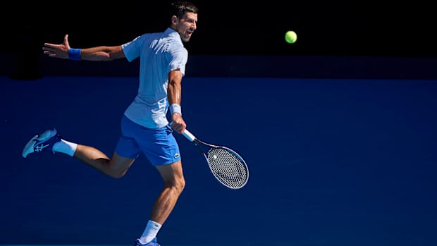 Novak Djokovic returns a shot.